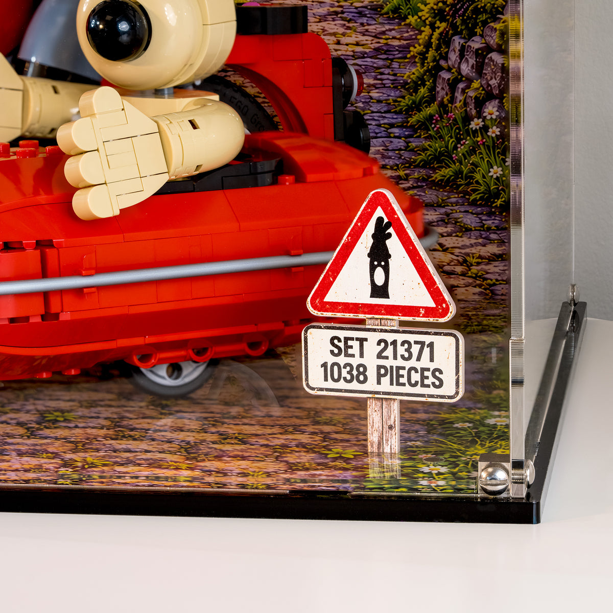 Close view of the road sign plaque reading Set 21371, 1038 pieces, beside the red sidecar