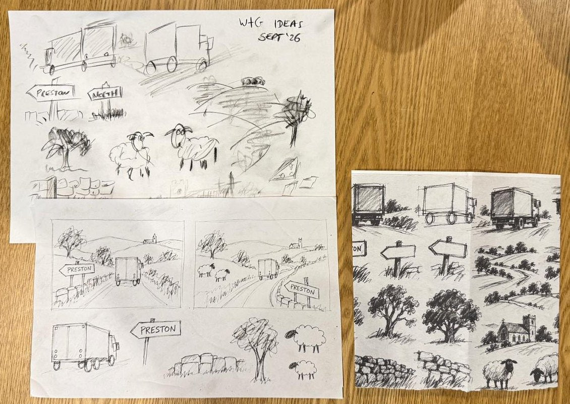 Pages of Wallace and Gromit sketches laid out on a wooden table
